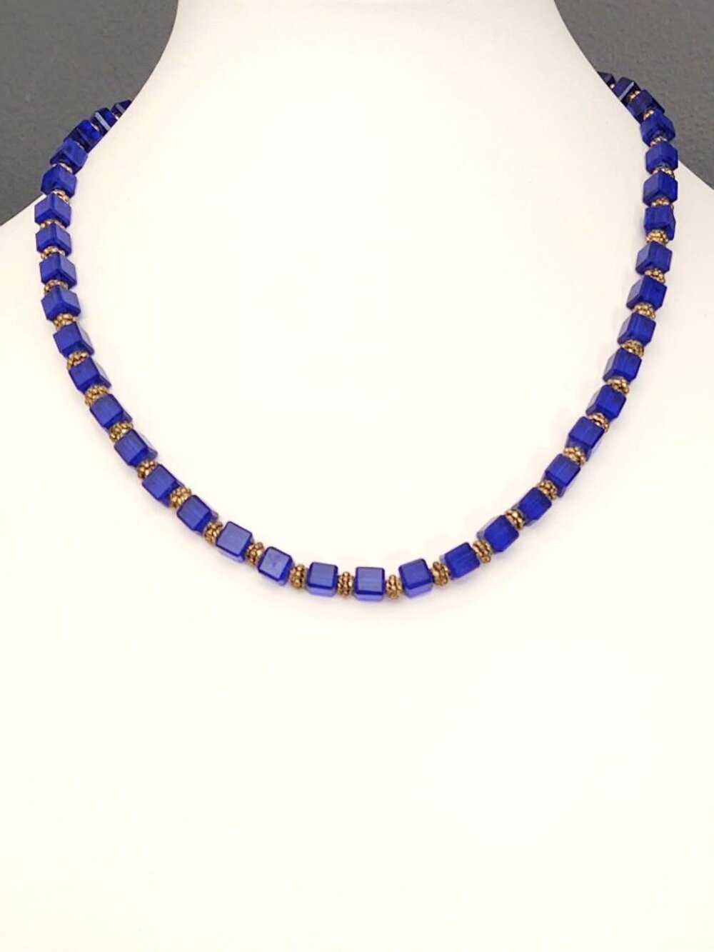 Blue glass cube necklace with gold accents